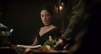 Movie still from “The Wolfman” (2010), directed by Joe Johnston – A woman sitting at a table with a plate of food in front of her; Close Up shot, Over the shoulder angle