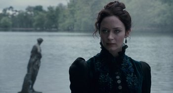 Movie still from “The Wolfman” (2010), directed by Joe Johnston – A woman standing in front of a body of water; Close Up shot, Over the shoulder angle