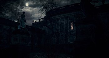 Movie still from “The Wolfman” (2010), directed by Joe Johnston – A creepy looking building with a full moon in the background; Extreme Wide shot, Low angle