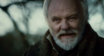 Movie still from “The Wolfman” (2010), directed by Joe Johnston – An old man with a beard and a scarf; Close Up shot, Low angle