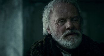 Movie still from “The Wolfman” (2010), directed by Joe Johnston – An old man with a white beard looking at the camera; Close Up shot, Low angle