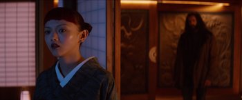 Movie still from “The Wolverine” (2013), directed by James Mangold – A person with a dragon's head on their shoulder; Close Up shot, Low angle