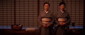 Movie still from “The Wolverine” (2013), directed by James Mangold – A couple of people that are standing up in a room; Medium shot, Low angle