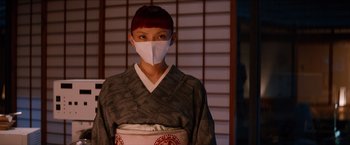 Movie still from “The Wolverine” (2013), directed by James Mangold – A person wearing a face mask standing in front of a window; Close Up shot, Low angle