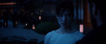 Movie still from “The Wolverine” (2013), directed by James Mangold – A woman in a white shirt standing in the dark; Close Up shot, Low angle