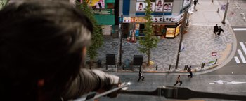 A man walking down the street from a building