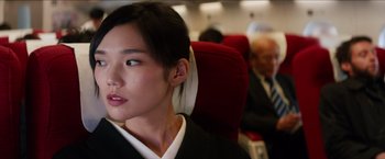 Movie still from “The Wolverine” (2013), directed by James Mangold – A woman sitting on a plane with her head resting on a pillow; Close Up shot, Low angle