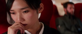 Movie still from “The Wolverine” (2013), directed by James Mangold – A young man sitting in a chair with his hand in his mouth; Close Up shot, Low angle