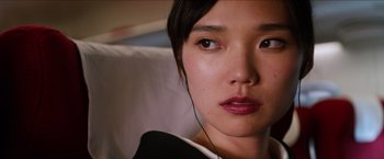 Movie still from “The Wolverine” (2013), directed by James Mangold – A person wearing headphones; Close Up shot, High angle