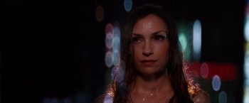 Movie still from “The Wolverine” (2013), directed by James Mangold – A beautiful woman standing next to a bunch of lights; Close Up shot, Low angle