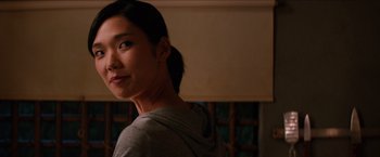 Movie still from “The Wolverine” (2013), directed by James Mangold – A young woman is looking into the distance; Close Up shot, Over the shoulder angle