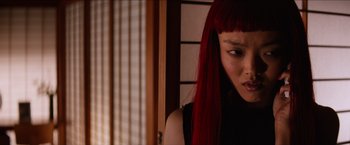 Movie still from “The Wolverine” (2013), directed by James Mangold – A person with long red hair; Close Up shot, Over the shoulder angle