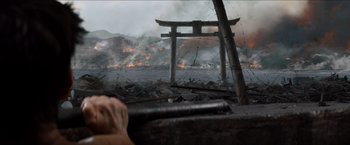 Movie still from “The Wolverine” (2013), directed by James Mangold – A view from a boat looking at a fire in the water; Close Up shot, Over the shoulder angle