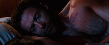 A person laying on a bed