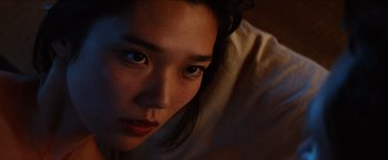 Movie still from “The Wolverine” (2013), directed by James Mangold – A woman's face in the dark; Close Up shot, Low angle