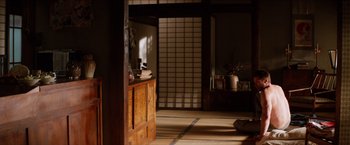 Movie still from “The Wolverine” (2013), directed by James Mangold – A room that has a wooden cabinet in it; Wide shot, High angle