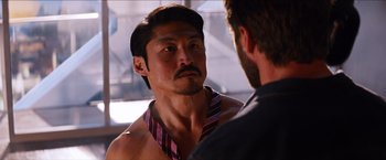 Movie still from “The Wolverine” (2013), directed by James Mangold – A man wearing a neck tie talking to another man; Close Up shot, Over the shoulder angle