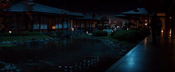 Movie still from “The Wolverine” (2013), directed by James Mangold – A pond in the middle of the night with a building in the background; Extreme Wide shot, High angle