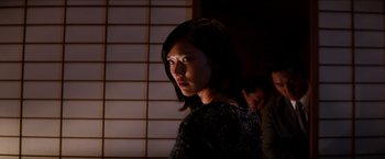 Movie still from “The Wolverine” (2013), directed by James Mangold – A woman standing in the dark with a light shining on her face; Close Up shot, Low angle