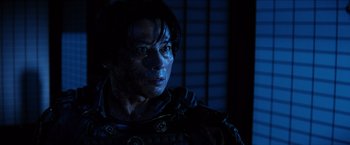 Movie still from “The Wolverine” (2013), directed by James Mangold – A man with a blue light on his face; Close Up shot, Low angle