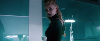 Movie still from “The Wolverine” (2013), directed by James Mangold – A beautiful blonde woman in a black dress; Medium shot, Low angle