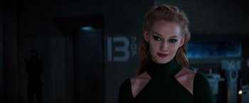 Movie still from “The Wolverine” (2013), directed by James Mangold – A woman in a black shirt and a ponytail; Close Up shot, Over the shoulder angle