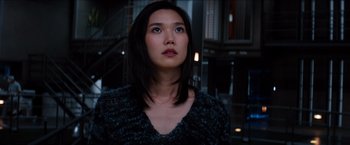 Movie still from “The Wolverine” (2013), directed by James Mangold – A woman looking up into the air in a dark room; Close Up shot, Low angle