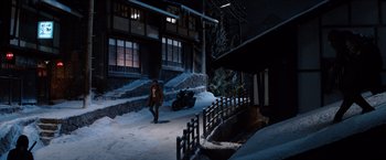 Movie still from “The Wolverine” (2013), directed by James Mangold – A person walking in the snow near a building; Extreme Wide shot, High angle