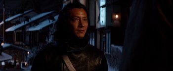 Movie still from “The Wolverine” (2013), directed by James Mangold – A man wearing a black leather jacket and standing in a dark room; Close Up shot, Over the shoulder angle