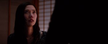 Movie still from “The Wolverine” (2013), directed by James Mangold – A woman sitting in front of a window looking up; Close Up shot, Over the shoulder angle