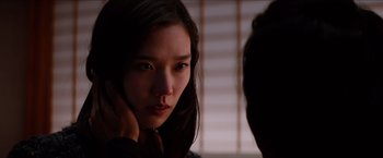 Movie still from “The Wolverine” (2013), directed by James Mangold – A young woman is looking at the camera; Close Up shot, Over the shoulder angle