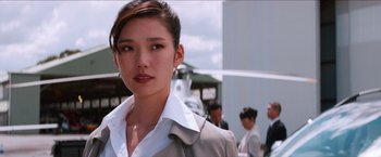 Movie still from “The Wolverine” (2013), directed by James Mangold – A woman in a white shirt and a gray jacket; Close Up shot, Low angle