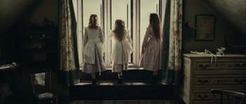 Movie still from “The Woman in Black” (2012), directed by James Watkins – Three little girls are standing in front of a window; Medium shot, Low angle