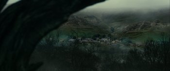 Movie still from “The Woman in Black” (2012), directed by James Watkins – A view of a small town in the middle of a valley; Extreme Wide shot, High angle