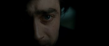 Movie still from “The Woman in Black” (2012), directed by James Watkins – A man's face with blue eyes; Extreme Close Up shot, Overhead angle