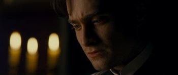 Movie still from “The Woman in Black” (2012), directed by James Watkins – A man's face in the dark; Close Up shot, Over the shoulder angle