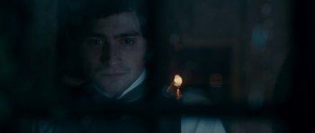 Movie still from “The Woman in Black” (2012), directed by James Watkins – A person in a suit and tie; Close Up shot, Over the shoulder angle