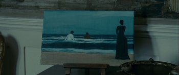 Movie still from “The Woman in Black” (2012), directed by James Watkins – A painting of people in the water on a beach; Extreme Wide shot, High angle