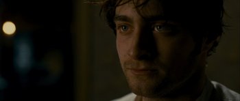 Movie still from “The Woman in Black” (2012), directed by James Watkins – A man's face in the dark; Close Up shot, Over the shoulder angle