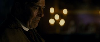 Movie still from “The Woman in Black” (2012), directed by James Watkins – A person looking at the camera; Close Up shot, Over the shoulder angle