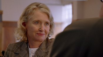 Movie still from “The World's Fastest Indian” (2005), directed by Roger Donaldson – An older woman sitting in front of another person; Close Up shot, Over the shoulder angle