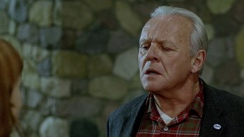 Movie still from “The World's Fastest Indian” (2005), directed by Roger Donaldson – An older man with a beard and a plaid shirt; Close Up shot, Over the shoulder angle