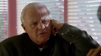 Movie still from “The World's Fastest Indian” (2005), directed by Roger Donaldson – An older man with white hair is looking at the camera; Close Up shot, Over the shoulder angle