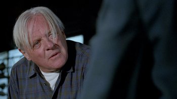 Movie still from “The World's Fastest Indian” (2005), directed by Roger Donaldson – An older man with white hair sitting in a room; Close Up shot, Low angle