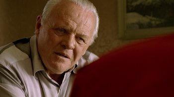 Movie still from “The World's Fastest Indian” (2005), directed by Roger Donaldson – An older man sitting in front of a mirror; Close Up shot, Over the shoulder angle