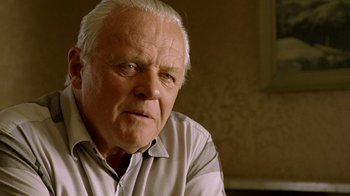 Movie still from “The World's Fastest Indian” (2005), directed by Roger Donaldson – An older man with white hair looking at the camera; Close Up shot, Over the shoulder angle