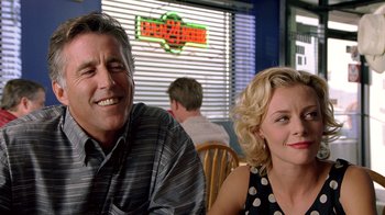 Movie still from “The World's Fastest Indian” (2005), directed by Roger Donaldson – A man and a woman sitting at a table in a restaurant; Close Up shot, Over the shoulder angle