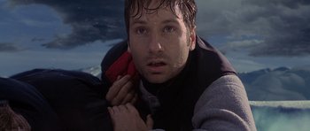 Movie still from “The X Files” (1998), directed by Rob Bowman – A person holding a cell phone; Close Up shot, Low angle