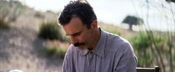 Movie still from “There Will Be Blood” (2007), directed by Paul Thomas Anderson – A person wearing a shirt; Close Up shot, Low angle