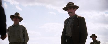 Movie still from “There Will Be Blood” (2007), directed by Paul Thomas Anderson – Medium shot, Low angle